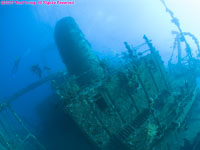 super wide angle view of wreck with divers